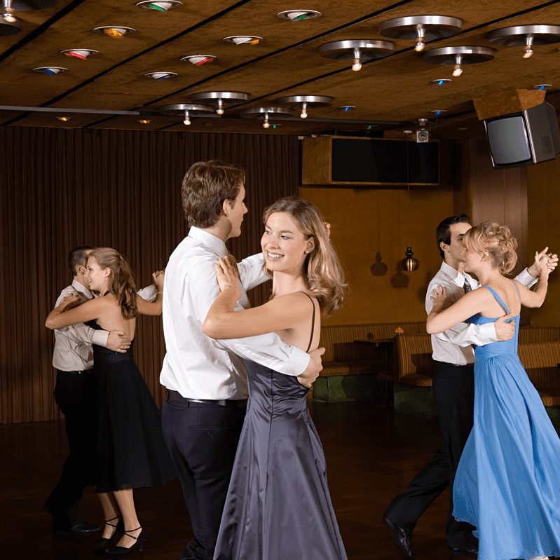 Group of dancers in formal attire.
